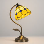 Yellow-white stained glass Tiffany-style table lamp, decorative piece for elegant interiors