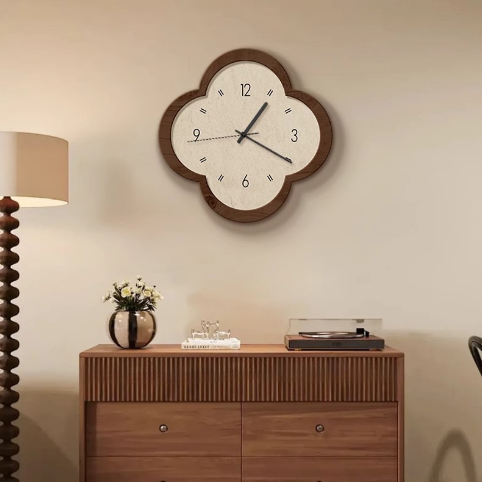 Unique clover-shaped wall clock with dark wooden frame and cream dial, minimalist numbers and slim black hands, ideal vintage-style décor for living rooms, bedrooms, or hallways