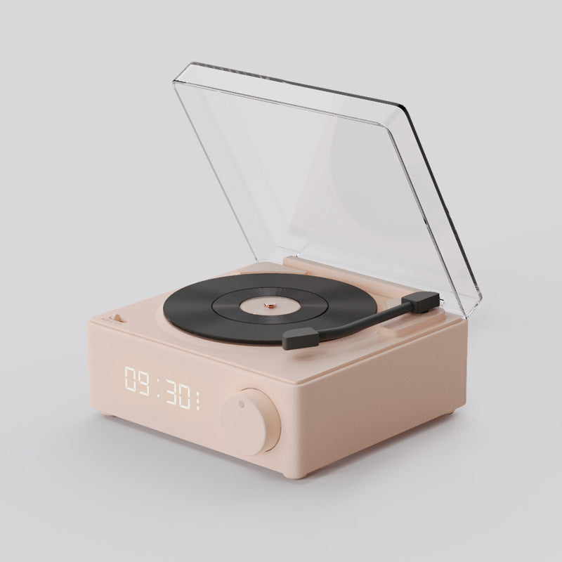 Pink gramophone-style Bluetooth speaker with copper horn and twin speakers, combining playful retro design with modern wireless sound