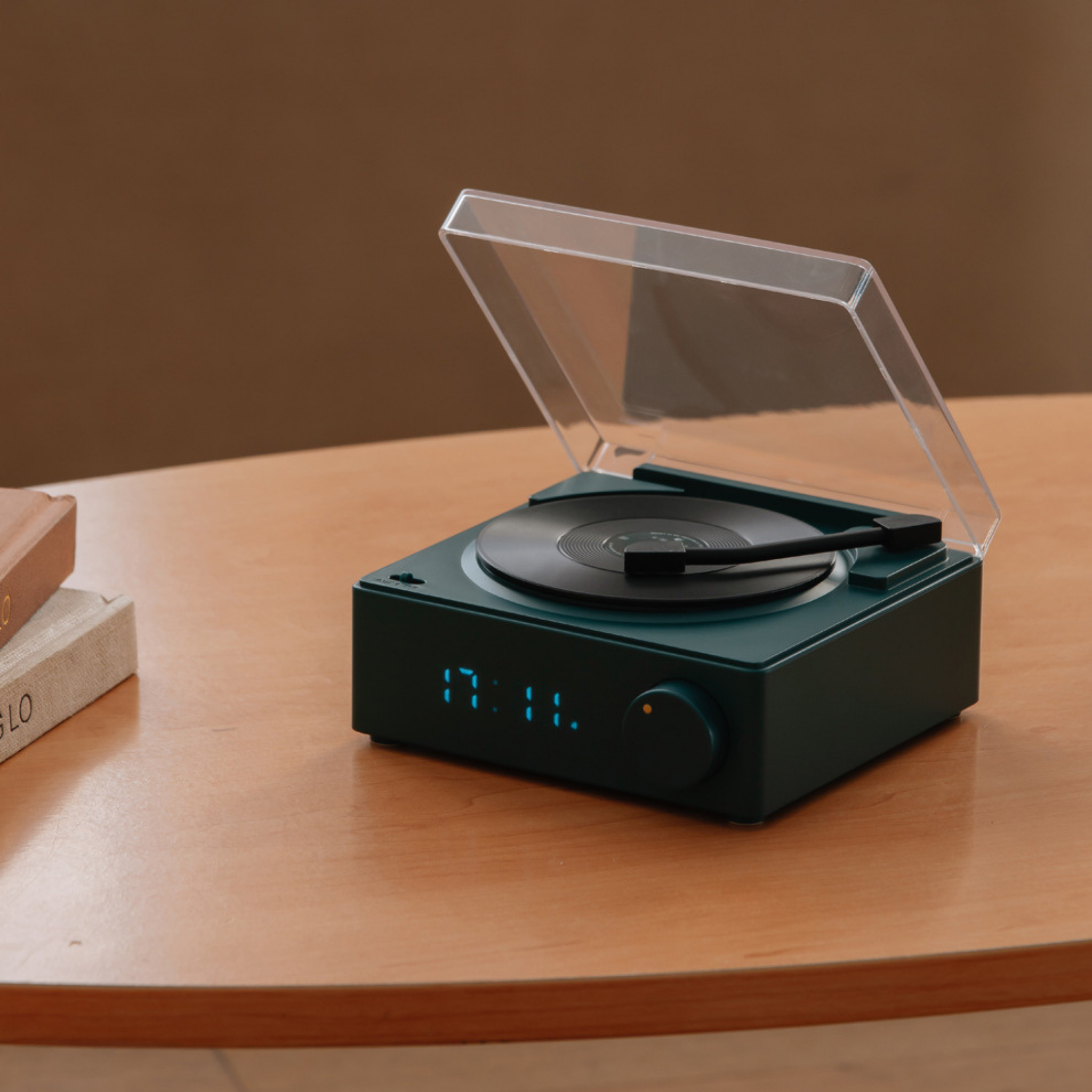 Retro-style Bluetooth record player with built-in speakers and clear dust cover, available in green, white, yellow, and pink, perfect vintage-inspired music player for modern homes