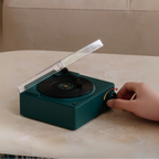 Retro wireless Bluetooth speaker with wooden finish and gramophone-style copper horn, delivering rich sound and stylish home décor appeal