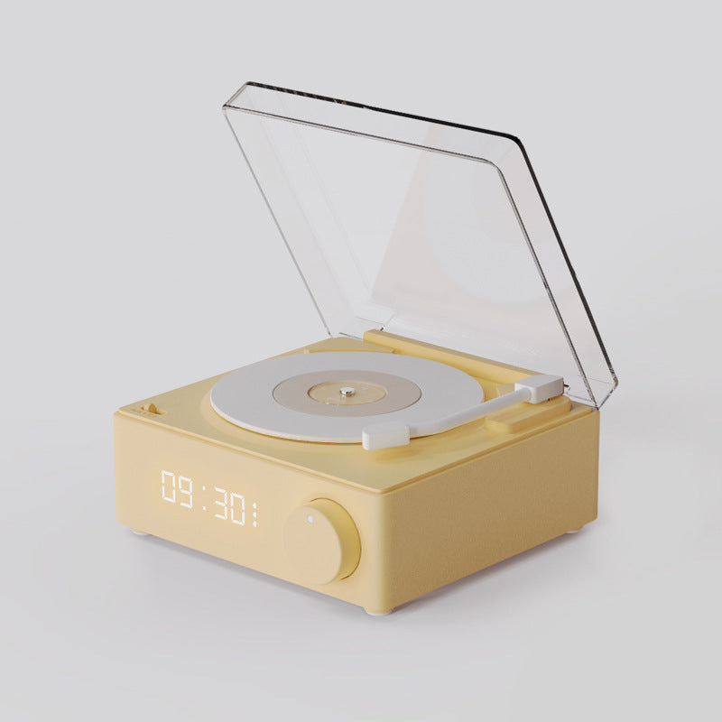Yellow gramophone-style Bluetooth speaker with copper horn and dual speakers, retro-inspired wireless music player for modern homes