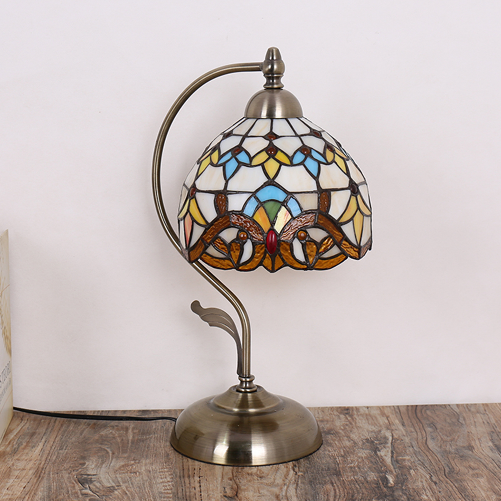 Amber Grace Lamp by KaShi Living — Tiffany-inspired stained glass table lamp with ivory, amber and blue details, elegant brass curved arm design