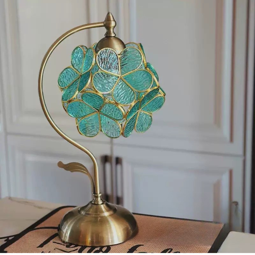 Aqua Petal Glow Lamp by KaShi Living — handcrafted stained glass table lamp with aqua petals and brass base, photographed in natural daylight