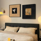 Aurelia Flight and Aurelia Bloom framed wall art displayed above a bed with warm lighting in a cosy bedroom by KaShi Living.