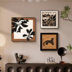 A warm neutral gallery wall display featuring Botanica framed wall art above a console table, ideal for UK hallways, bedrooms and styled living spaces.