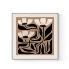 A graphic floral framed wall art piece in black and warm neutral tones for UK living rooms, bedrooms and hallway styling.