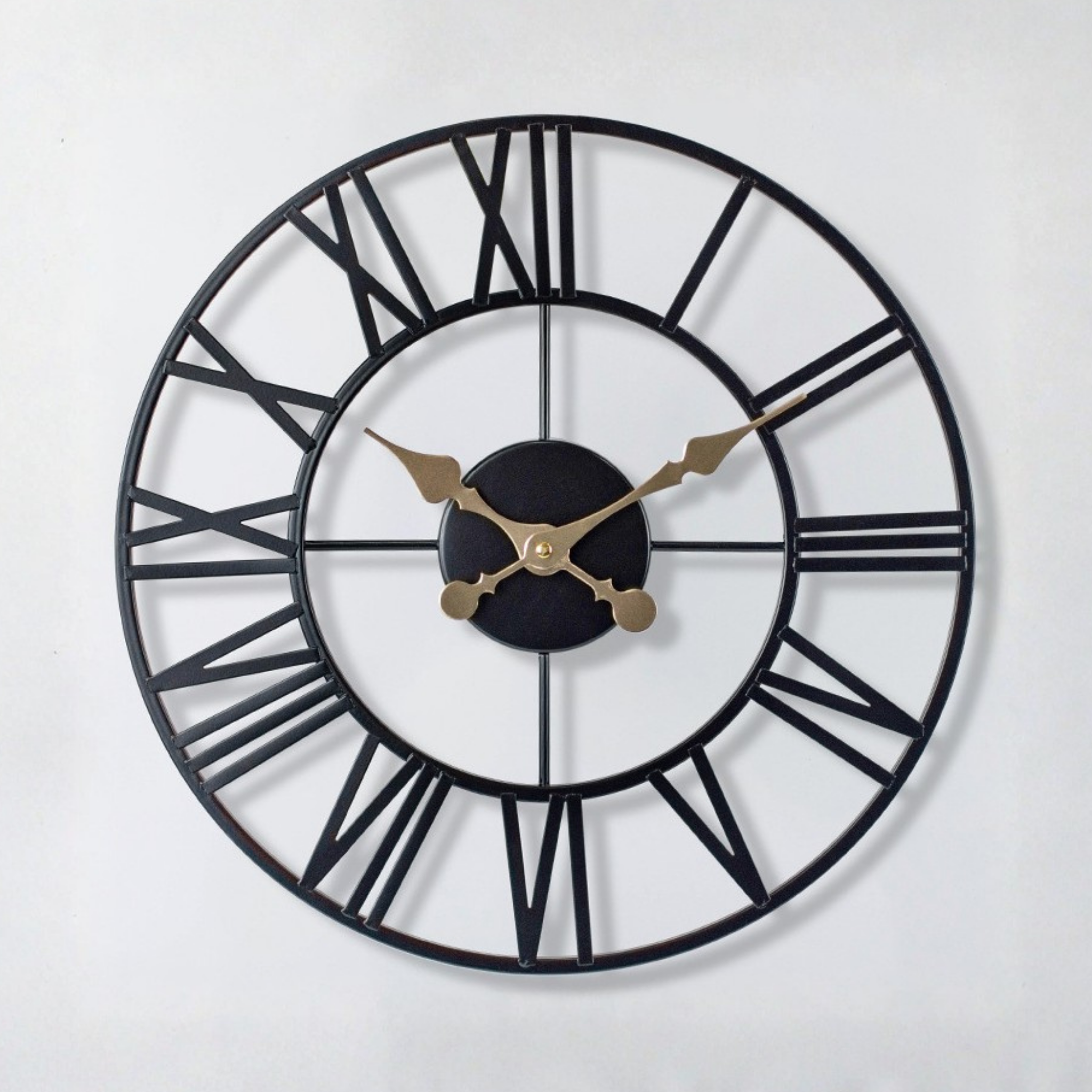 Cambridge Roman Clock by KaShi Living — open-frame black metal wall clock with gold hands and Roman numerals, elegant home accent