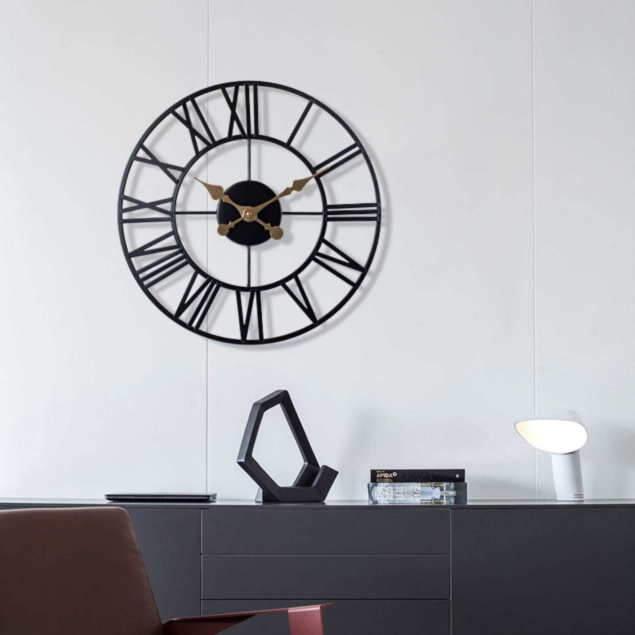 Cambridge Roman Clock on white wall — sleek openwork design in black metal with gold hands, perfect for offices or living spaces, KaShi Living