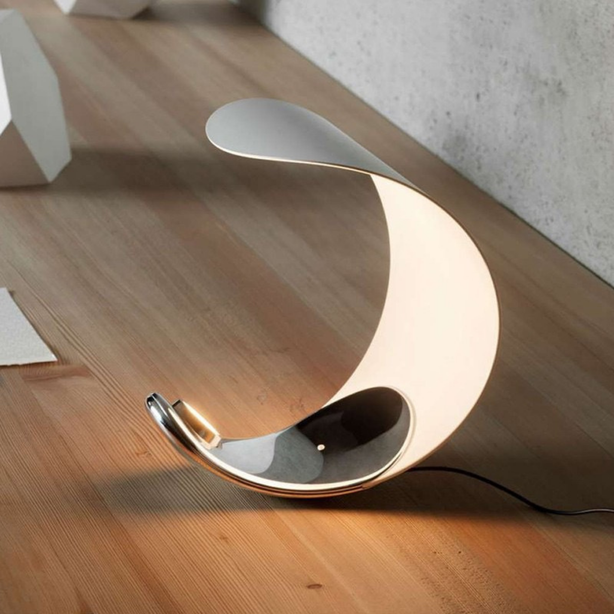 Eclipse Arc Lamp by KaShi Living — artistic crescent-shaped modern lamp with soft ambient glow, sculptural lighting for minimalist interiors