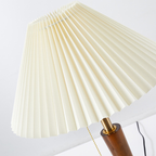 Close-up of the Arden Pleat Table Lamp showing the folded cream shade, pull-chain switch, warm-toned central stem and rounded base.