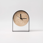 A stone-effect arch table clock with a black frame, ideal for shelves, desks, bedside tables and modern UK home décor.