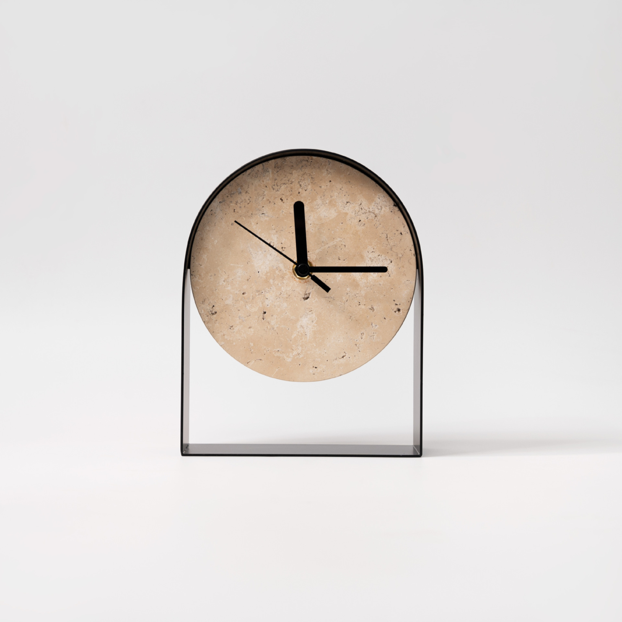 A stone-effect arch table clock with a black frame, ideal for shelves, desks, bedside tables and modern UK home décor.
