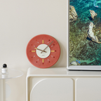 Decorative wall clock for living room, kitchen, bedroom or hallway with a warm terracotta/auburn colour and modern everyday style.