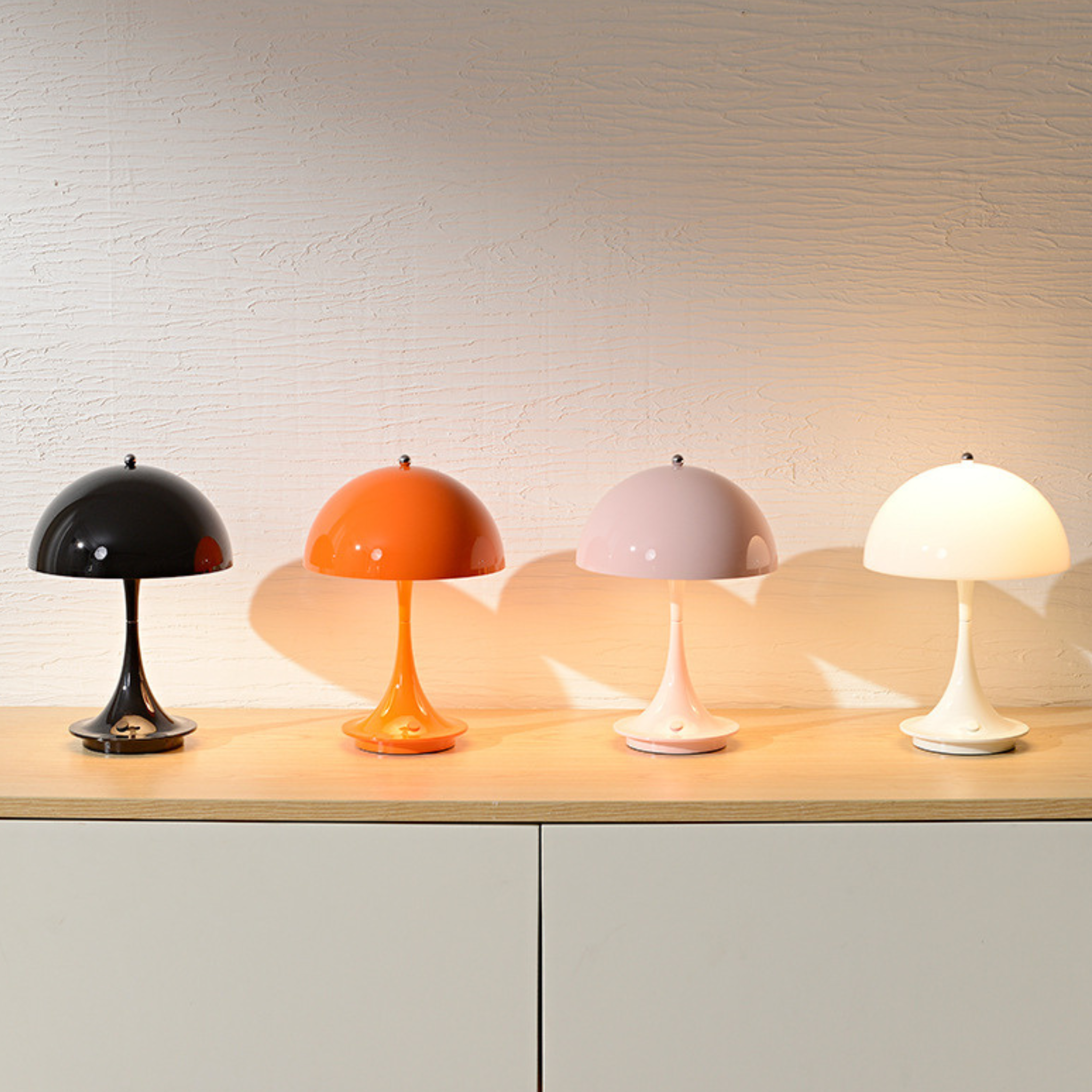 Glossy dome rechargeable table lamp for bedside tables, desks and cosy living room corners. Available in playful modern colours.