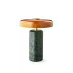 Elara Disc Portable Table Lamp with a dark green stone-effect base, amber rounded shade and gold-tone details.