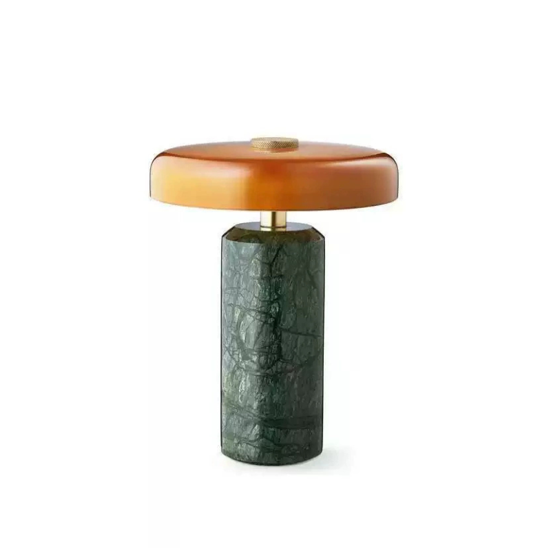 Elara Disc Portable Table Lamp with a dark green stone-effect base, amber rounded shade and gold-tone details.