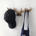 Decorative antler-style wall hook for coats, keys, bags and hallway styling. A rustic accent for cosy UK homes.