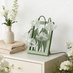 A clear floral table lamp with soft bell-shaped shades, perfect for cosy bedrooms, bedside tables and living room corners.