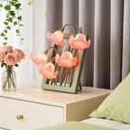 A pink floral table lamp with bell-shaped flower shades for UK bedrooms, bedside tables, desks and cosy living room corners.