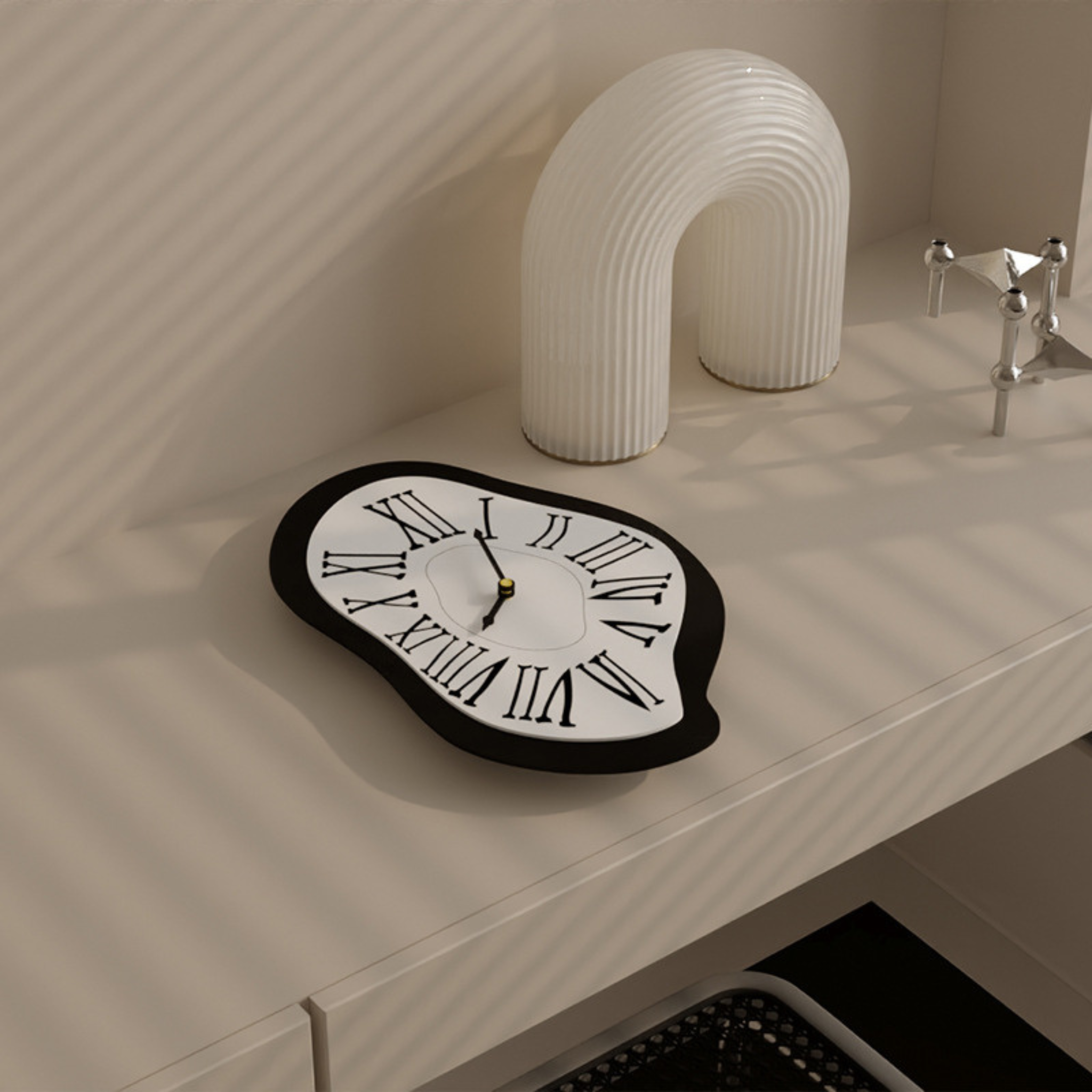 A black and white melted Roman wall clock for playful living room, bedroom, hallway or home office wall décor.