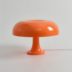 Orange Orla Halo Table Lamp with a glossy rounded shade and pedestal base – KaShi Living.