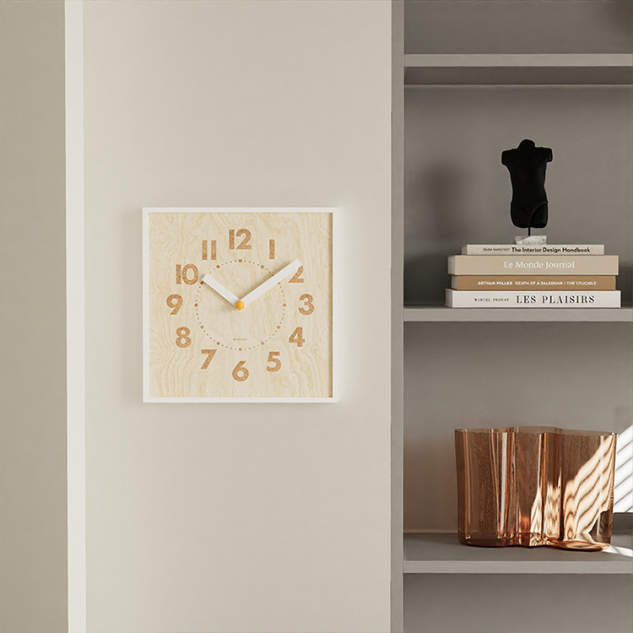 A square light wood-effect wall clock with bold numbers and a white frame, ideal for UK living rooms, kitchens and hallways.
