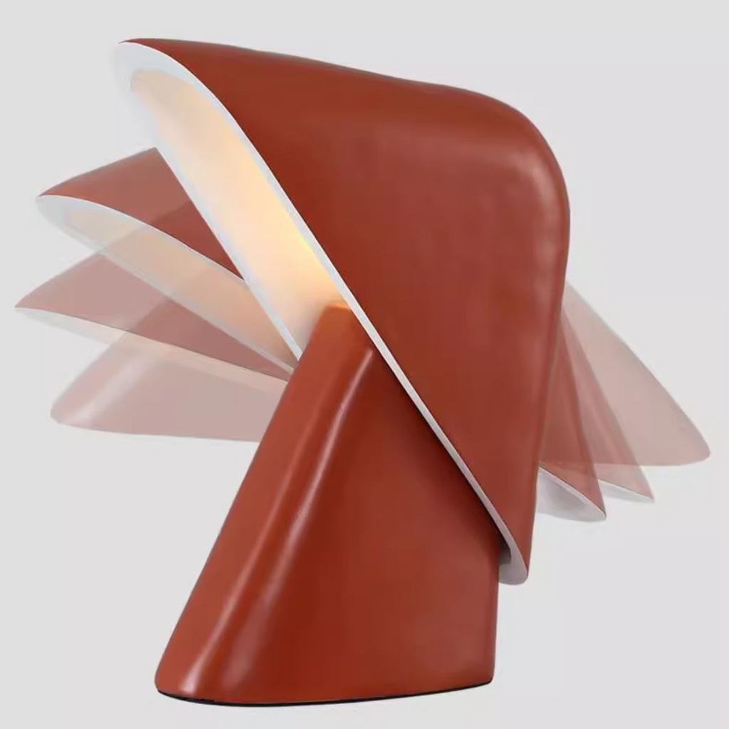Modern red table lamp rotating and adjusting angel with a unique design on a white background