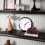 A black and white pixel-style wall clock for UK bedrooms, offices, kitchens and modern living room walls.