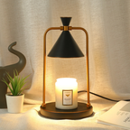 Sienna Midnight Cone Candle Warmer Lamp with a black shade, black base and gold frame, displayed with a white jar candle.