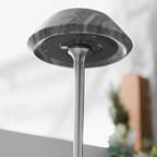 A stone-effect portable table lamp for bedside tables, desks and cosy living room corners. Soft, modern lighting for UK homes.