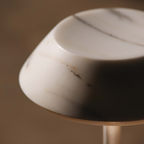 Close-up of a textured white stone  portable table lamp