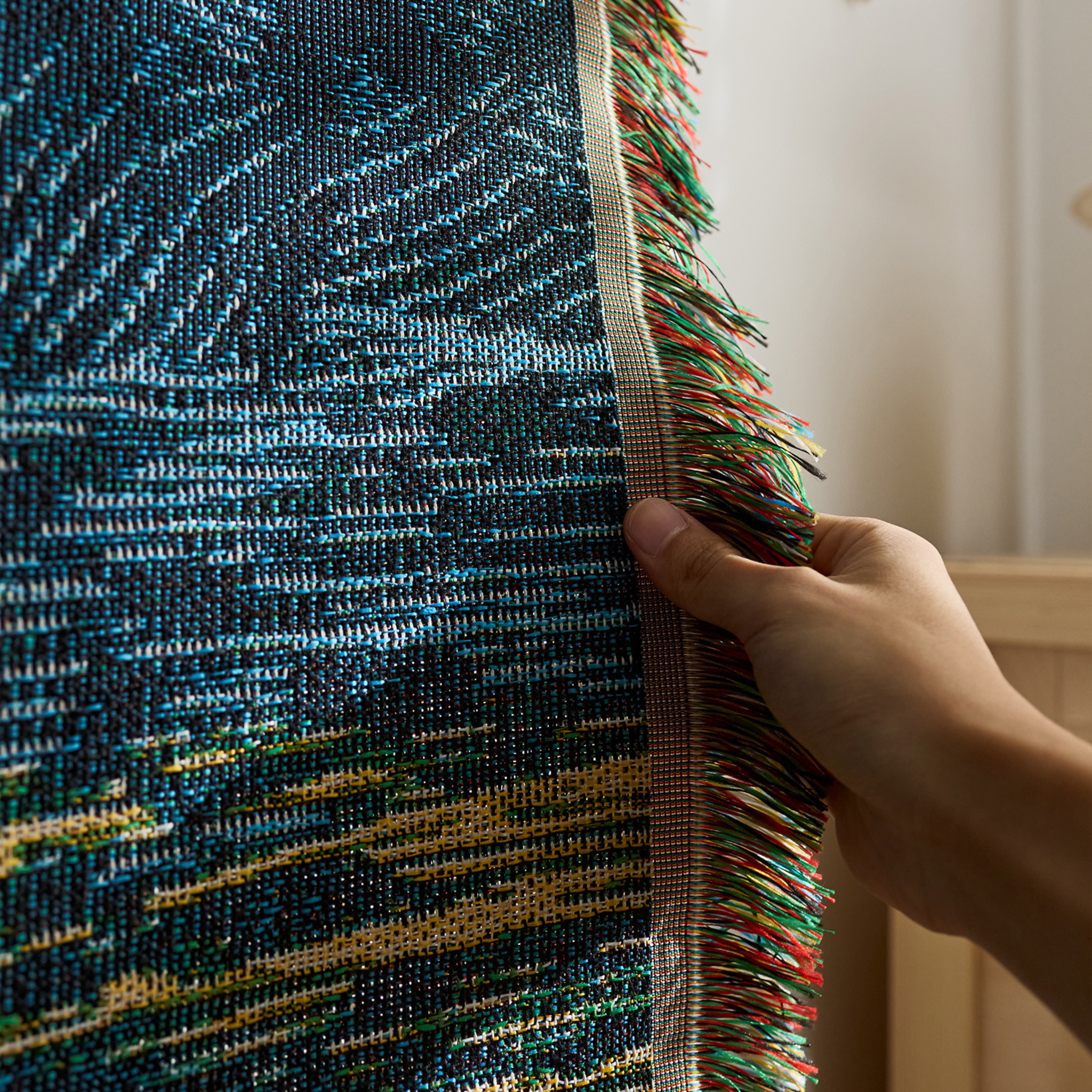 A retro textile wall art piece with a scenic woven pattern and fringe edges, designed for UK bedrooms, living rooms and cosy rented homes.