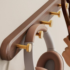 walnut hook panel with gold accents 