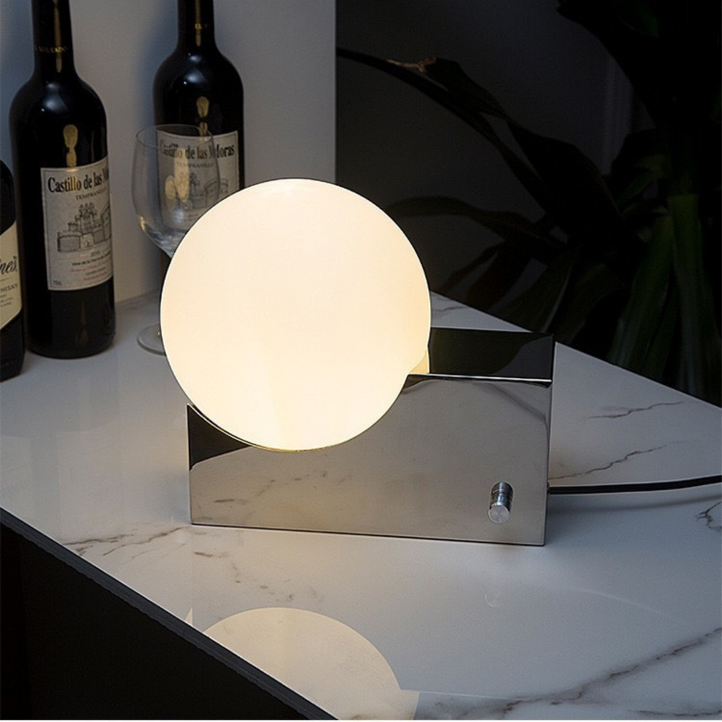 Luna Orbit Lamp in Silver — warm ambient lighting on marble surface, elegant orb design for sophisticated home styling, KaShi Living