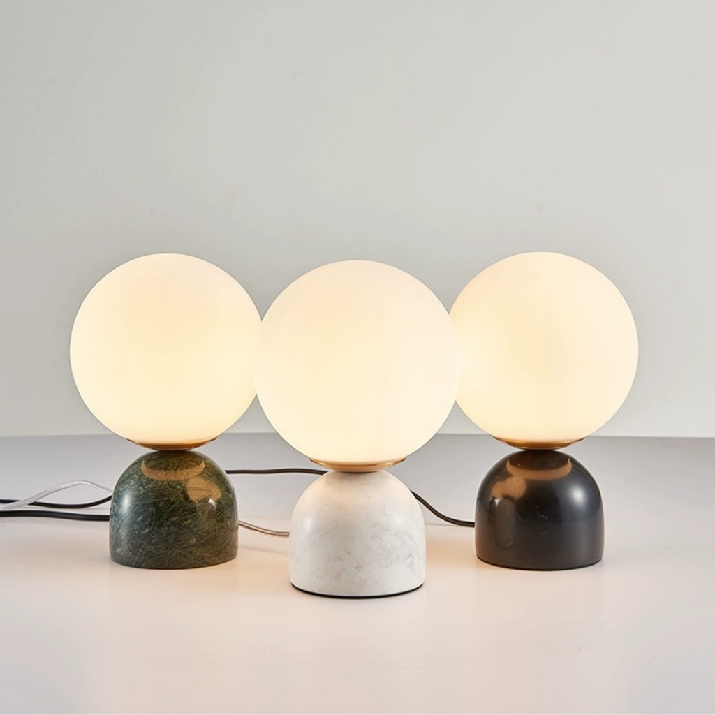 Luna Stone Lamp trio by KaShi Living — spherical frosted glass lights with marble-effect bases in black, white, and green, modern ambient lighting
