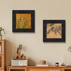 Two botanical framed wall art prints styled above a wooden console in a calm neutral living room by KaShi Living