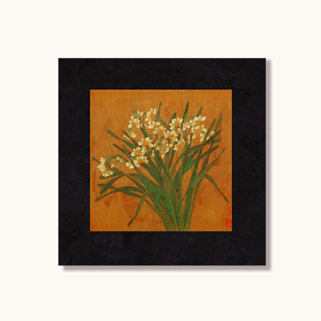 Black framed botanical wall art with white meadow flowers on warm ochre background by KaShi Living