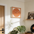 Bright orange box desk clock for shelves, desks and bedside tables, adding a playful modern accent to UK homes.