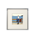A coastal framed wall art print with a quiet harbour scene, ideal for UK living rooms, bedrooms, hallways and gallery walls.