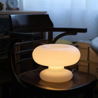 A softly rounded table lamp with a warm ambient glow, ideal for bedside tables, living rooms and cosy corners in stylish UK homes.