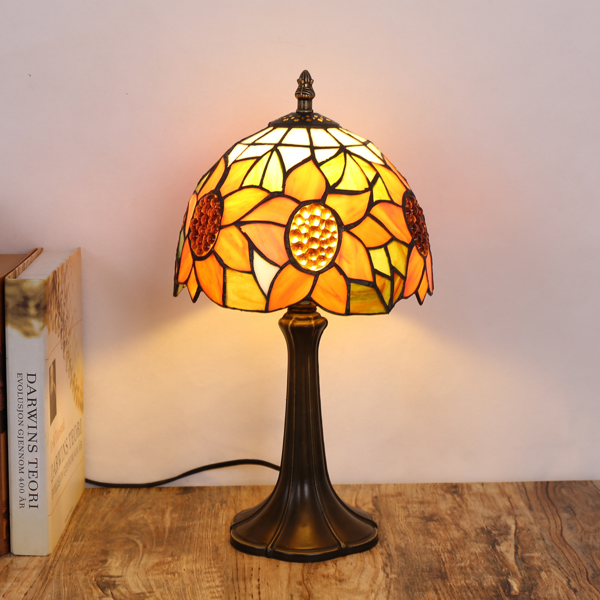 Sunlit Bloom Lamp glowing warmly, showcasing sunflower-patterned stained glass in amber and gold tones — elegant handcrafted home lighting by KaShi Living